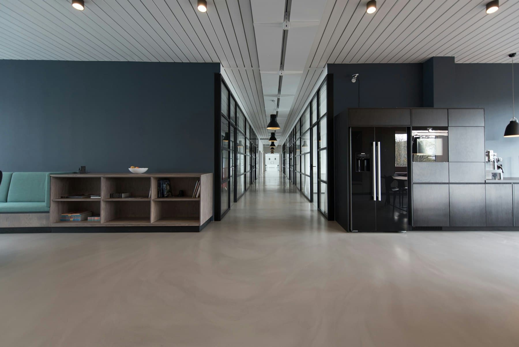 Office interior with meeting rooms and a staff kitchen